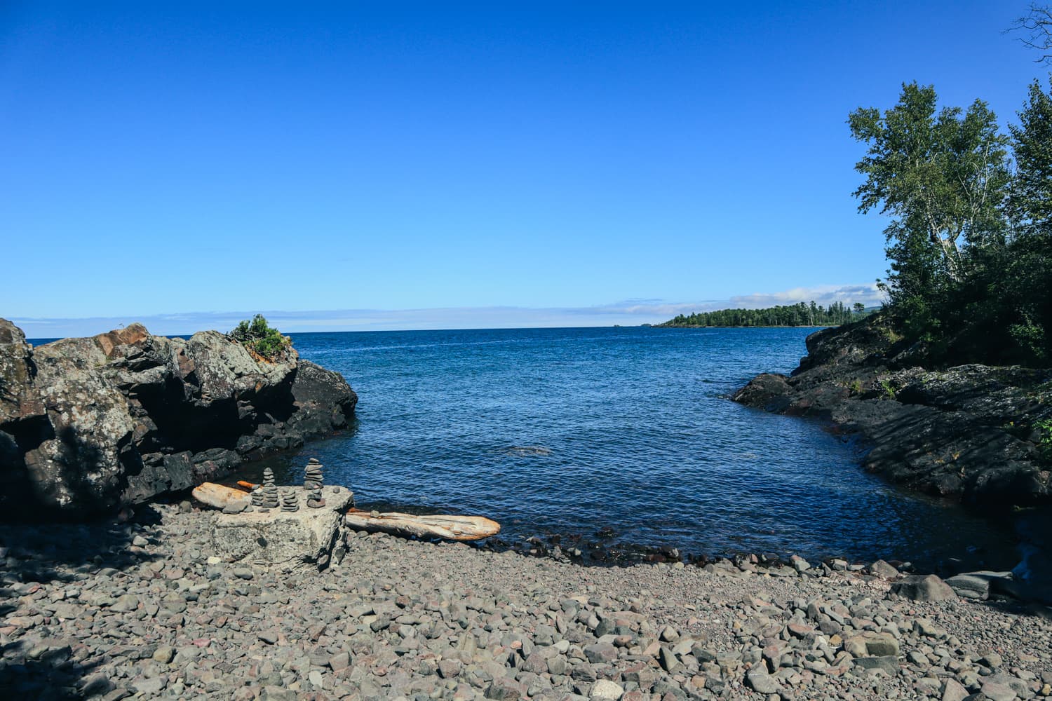 Rocky Lake Superior shoreline and the blue waters of Eagle Harbor near the lighthouse grounds